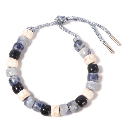 Le Sodalite Howlite a perlé le bracelet 13.5g avec la corde argentée tressée