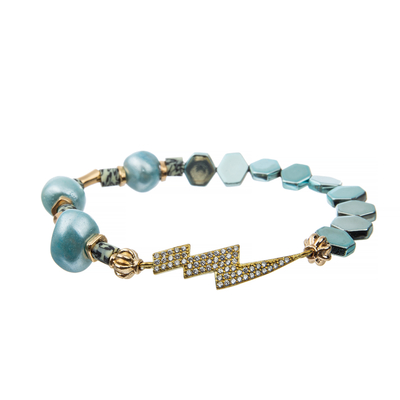La turquoise bleue de bracelet perlé fait main de Polyclay de léopard d'hématite d'hexagone a plaqué