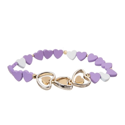 Le coeur peint d'hématite a perlé coloré réglable empilé de bracelet extensible
