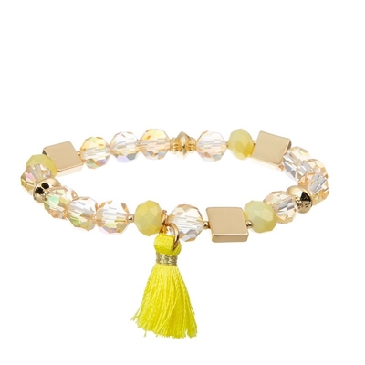 Paquet empilable élastique jaune de bracelet tissé par Boho de gland pendant des années de l'adolescence